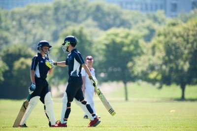 Students playing cricket