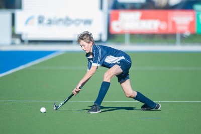 Student playing hockey