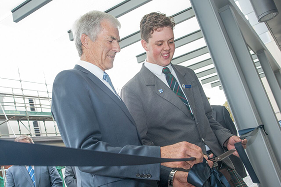 Former Rector Barry Maister and Head Boy Caleb Morgan cutting a ribbon