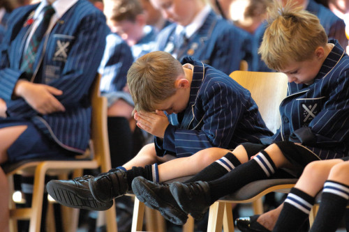 Preparatory School student praying in the Chapel