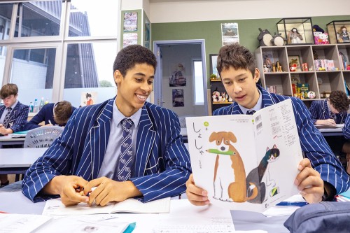 Students reading a Japanese book in class.