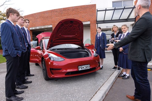 Year 13 students and Senior College Office Administrator, Jocelyn Simmons, with Focus group speaker, Sam Wilkinson, from Tesla.